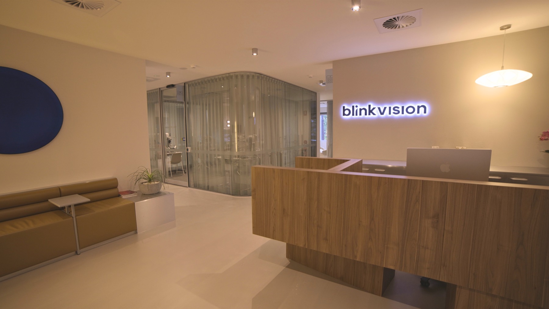 Blink reception with a timber desk and leather seating
